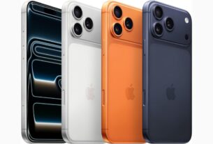iPhone 17 Pro Max na cor titânio natural sendo segurado por uma pessoa exposto à luz do dia mostrando as bordas finas.